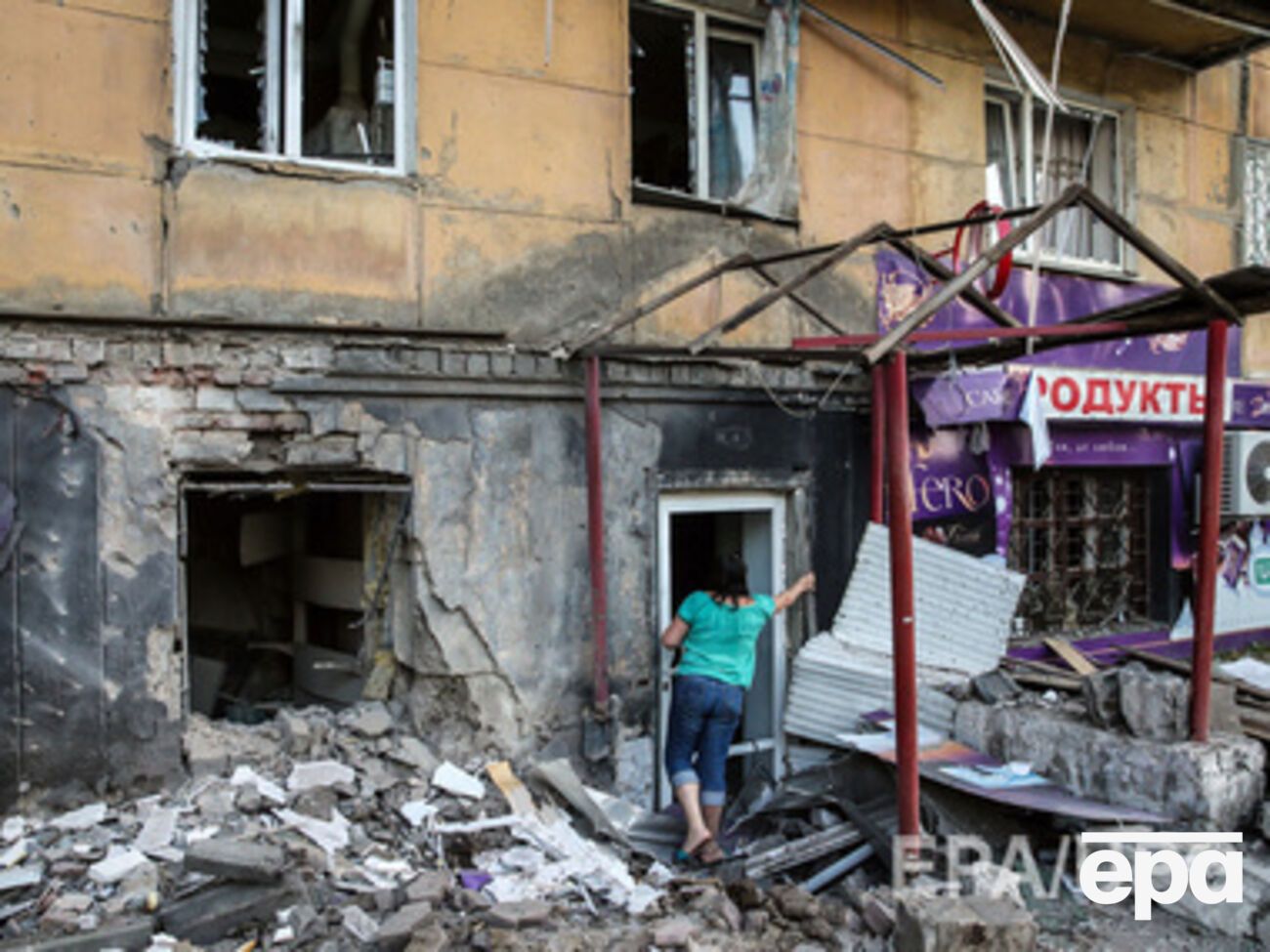 Меркель помнит Донецк целым, фото разрушенных домов ее поразили