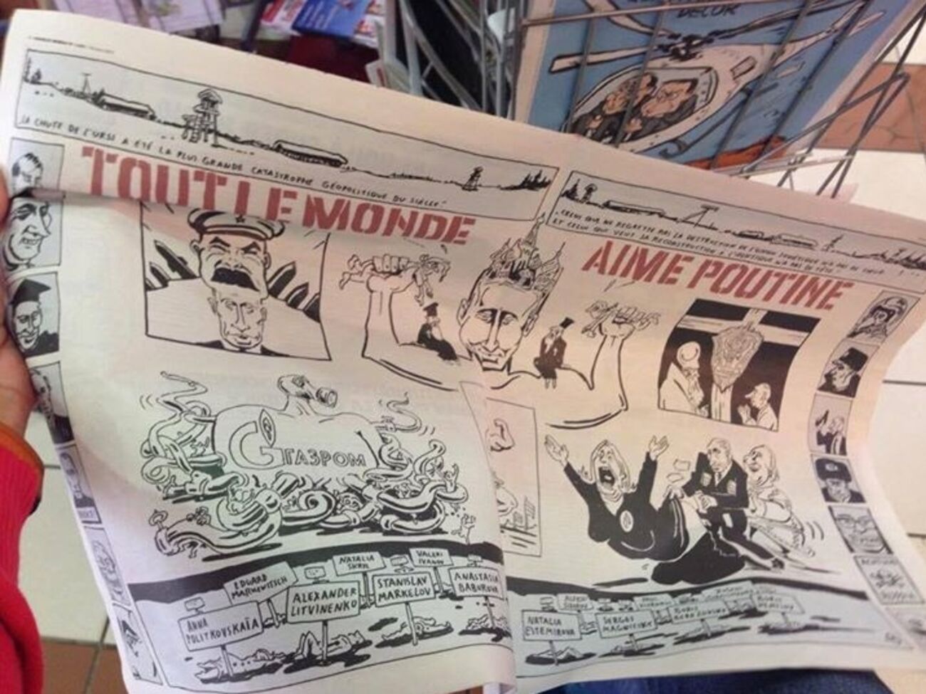 Адагамов: Сцена тройного соития с Марин ле Пен и Депардье, герб КГБ на кресте, спрут Газпрома, а внизу – трупы, лежащие в крови