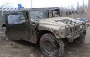 Спикер МВД показал снимки "Хаммера" обстрелянной под Трехизбенкой мобильной группы. Фоторепортаж