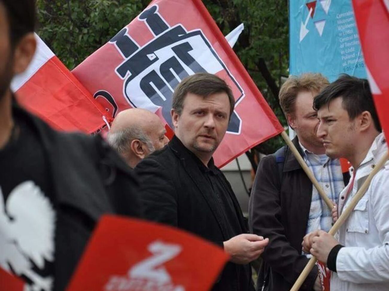 Матеуша Пискорского (в центре) арестовали по подозрению в шпионаже в пользу России