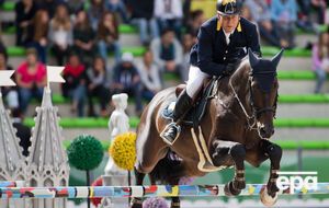 Онищенко во время выступления на Всемирных конных играх 2014 года