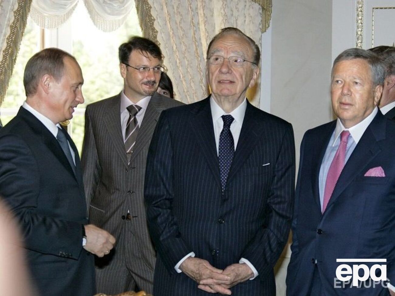 Встреча в Санкт-Петербурге в 2005 году. Путин (крайний слева) и Крафт (крайний справа)