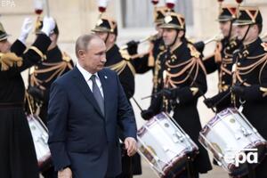 Першу зустріч у Парижі Путін (на фото) провів із Меркель