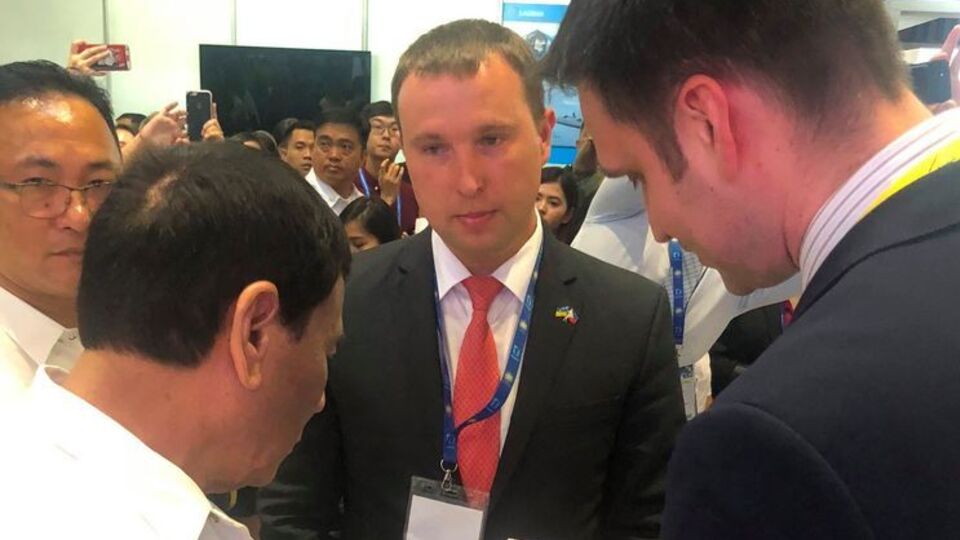 Бельбас (на фото в центре) был арестован 6 марта