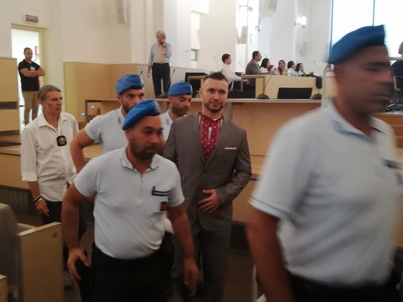Маркива (на фото в центре) приговорили к 24 годам тюрьмы