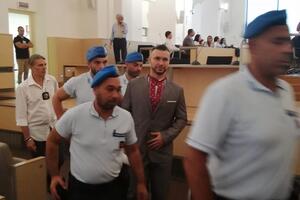 Маркива (на фото в центре) приговорили к 24 годам тюрьмы