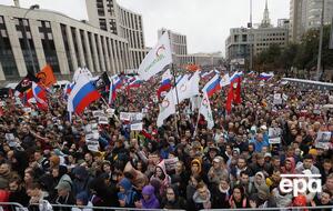 В Москве в санкционированной акции в поддержку оппозиционных кандидатов в Мосгордуму приняли участие около 49 тыс. человек. Фоторепортаж