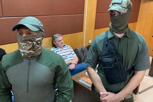 Гримчака (на фото сидить) заарештували на два місяці