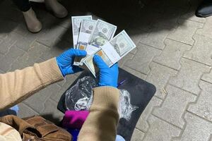 Женщину задержали после получения денег