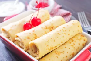 Млинці із сирною начинкою випікаємо 20 хвилин у розігрітій до 180 °С духовці