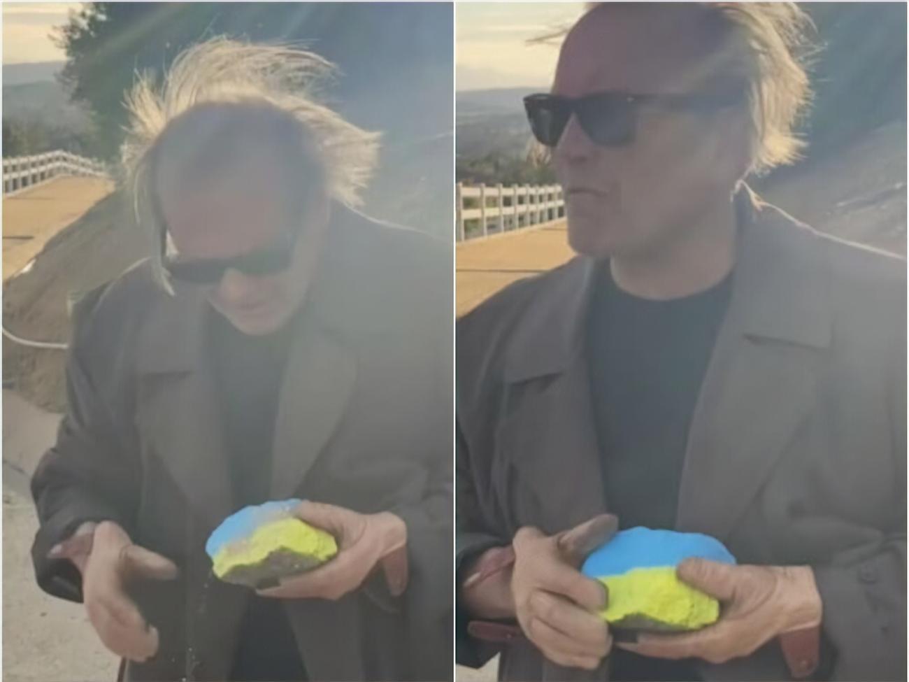 В кадре Дизин прижимает к себе флаг Украины