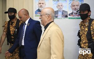 СМИ пишут, что ранее на аль-Рахави (на фото в центре) покушались