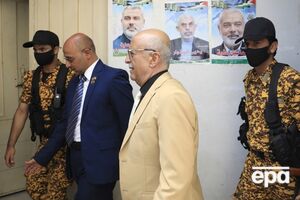 СМИ пишут, что ранее на аль-Рахави (на фото в центре) покушались