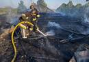 РФ уночі била по Україні дронами. У Києві горіла висотка, у Дніпрі поранено людину. Фото