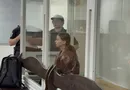 Замість куртки за €3 тис. – жакет за "жалкі" 14 тис. грн. Музу з "Карфагену" вивели в кайданках. Відео